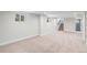 Spacious basement area with neutral carpet, clean white walls and recessed lighting at 2659 Ash St, Denver, CO 80207