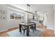 Dining area features a large table, modern lighting, and views to the kitchen at 2659 Ash St, Denver, CO 80207