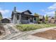 Charming single-Gathering home with a well-manicured lawn and an inviting covered front porch at 2659 Ash St, Denver, CO 80207
