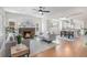 Inviting living room with a cozy fireplace, hardwood floors, and an open layout at 2659 Ash St, Denver, CO 80207
