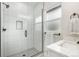 Beautiful walk-in shower with subway tile, glass door, and matte black hardware at 2659 Ash St, Denver, CO 80207