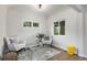 Cozy sitting room featuring hardwood floors, neutral walls, and natural light at 2659 Ash St, Denver, CO 80207