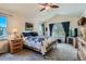 Bright primary bedroom boasts vaulted ceilings, multiple windows and plush carpeting at 13962 Dexter Way, Thornton, CO 80602