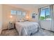 Serene bedroom with a comfortable bed, ample natural light, and cozy decor at 13962 Dexter Way, Thornton, CO 80602