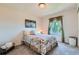 Charming bedroom with floral bedding, soft natural light, and peaceful ambiance at 13962 Dexter Way, Thornton, CO 80602