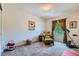 Inviting bedroom showcasing comfortable seating, warm lighting, and neutral decor at 13962 Dexter Way, Thornton, CO 80602