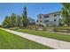 Charming home with well-maintained lawn, inviting curb appeal, and mature landscaping at 13962 Dexter Way, Thornton, CO 80602