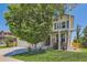 Beautiful two-story home with a well-manicured lawn, mature trees, and charming curb appeal at 13962 Dexter Way, Thornton, CO 80602