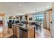 Spacious kitchen features a breakfast nook, granite countertops, and stainless steel appliances at 13962 Dexter Way, Thornton, CO 80602