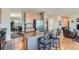 Open kitchen features granite countertops, stainless steel appliances and cozy breakfast bar at 13962 Dexter Way, Thornton, CO 80602
