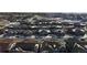 Aerial view of a residential neighborhood, showing rooftops and streets in winter at 4078 Happy Hollow Dr, Castle Rock, CO 80104