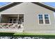 Exterior side view shows a fenced yard, a covered patio, and low-maintenance lawn at 4078 Happy Hollow Dr, Castle Rock, CO 80104