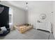 Bright bedroom features a patterned rug, white dresser, and a cozy toddler bed at 4078 Happy Hollow Dr, Castle Rock, CO 80104