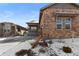 A beautifully designed house with a welcoming porch and a well-maintained front yard at 4078 Happy Hollow Dr, Castle Rock, CO 80104