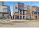 Modern townhouse with a combination of brick and siding, plus a small front porch at 3830 Jason St # 4, Denver, CO 80211