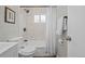 Bathroom featuring new vanity, a mirror, and shower with marble tiling at 957 Newton St, Denver, CO 80204