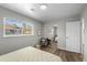 Light bedroom with hardwood floors, a large window, closet, and neutral tones at 957 Newton St, Denver, CO 80204