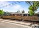 Charming brick home with well-maintained fencing and landscaping at 957 Newton St, Denver, CO 80204