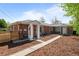 Charming brick home with landscaped front yard and welcoming entrances at 957 Newton St, Denver, CO 80204