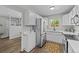 Open kitchen design with stainless steel appliances and easy access to living areas creating a welcoming atmosphere at 957 Newton St, Denver, CO 80204