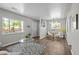 Inviting living and dining areas featuring wood floors and modern lighting, perfect for entertaining and relaxation at 957 Newton St, Denver, CO 80204