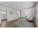 Inviting living room with modern decor, wood-look floors, and bright natural light at 957 Newton St, Denver, CO 80204