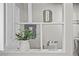 Close up of kitchen shelving with decorative jars and decorations at 957 Newton St, Denver, CO 80204
