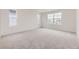 Large bedroom with carpet, neutral paint, recessed lighting, and lots of natural light at 7276 Waterleaf Trl, Littleton, CO 80125