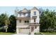 Charming two-story home featuring stone accents, a balcony, and an attached two car garage at 7276 Waterleaf Trl, Littleton, CO 80125