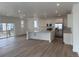 This spacious kitchen offers white cabinets, stainless steel appliances, and an open-concept layout with great natural light at 7276 Waterleaf Trl, Littleton, CO 80125