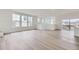 Large living room with hardwood floors, neutral paint, recessed lighting, and lots of natural light at 7276 Waterleaf Trl, Littleton, CO 80125