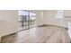 Bright Living room leading to deck area, hardwood floors, neutral paint, recessed lighting, and lots of natural light at 7276 Waterleaf Trl, Littleton, CO 80125