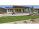 Lovely outdoor space with a covered porch and green grass at 20 Leafy Aster Ln, Castle Rock, CO 80104