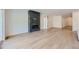 Spacious living room with a modern fireplace, hardwood floors, and bright natural light at 20 Leafy Aster Ln, Castle Rock, CO 80104
