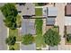 Aerial view of property featuring a lush green lawn and detached garage at 4451 Eliot St, Denver, CO 80211