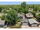 Aerial view of property featuring a lush green lawn and detached garage at 4451 Eliot St, Denver, CO 80211