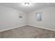 Carpeted basement bedroom with small windows, perfect for an additional bedroom or guest room at 4451 Eliot St, Denver, CO 80211