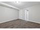 Cozy basement bedroom or bonus room with carpet, adjacent to a bathroom at 4451 Eliot St, Denver, CO 80211