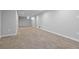 Spacious basement with carpet and neutral walls, perfect for storage or finishing at 4451 Eliot St, Denver, CO 80211