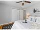 Comfortable bedroom featuring closet, soft carpet, and bright light at 4451 Eliot St, Denver, CO 80211