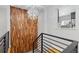 Modern hallway featuring decorative walls, modern stairs, and an interesting light fixture at 4451 Eliot St, Denver, CO 80211