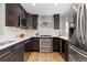 Stylish kitchen equipped with stainless steel appliances, a tiled backsplash, and ample countertop space at 4451 Eliot St, Denver, CO 80211