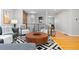 Spacious living room showcasing hardwood floors, modern decor, and plenty of room for entertaining at 4451 Eliot St, Denver, CO 80211