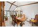 Elegant dining area with a wood table and comfortable seating, perfect for Gathering meals at 4677 S Wolff St, Denver, CO 80236