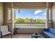Balcony with patio furniture and an open view of trees at 8445 S Holland Way # 205, Littleton, CO 80128