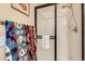 Bathroom with shower stall and colorful towels displayed on the towel bar at 8445 S Holland Way # 205, Littleton, CO 80128