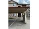 Exterior view of condo showing carport and stairs to units at 8445 S Holland Way # 205, Littleton, CO 80128