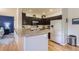 Well-equipped kitchen featuring granite countertops, stainless steel appliances, and hardwood flooring at 8445 S Holland Way # 205, Littleton, CO 80128