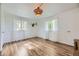 Bright bedroom with hardwood floors, white trim, and ample natural light at 947 S Yates St, Denver, CO 80219