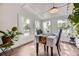 Bright dining room with lots of natural light from large windows and hardwood floors at 947 S Yates St, Denver, CO 80219